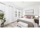 Bright and airy bedroom with large windows, neutral carpet, and modern furnishings at 353 Skylar Se Way, Atlanta, GA 30315