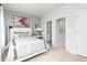 Cozy bedroom with ensuite access; features soft carpet and calming gray walls at 353 Skylar Se Way, Atlanta, GA 30315