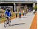 People enjoy the BeltLine trail for biking, walking, and socializing under a sunny sky at 353 Skylar Se Way, Atlanta, GA 30315