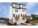 Modern two-story townhouse with white siding, private balconies, and attached garages at 353 Skylar Se Way, Atlanta, GA 30315