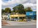 Shops with ample parking, trees, and greenery on a partly cloudy day in the shopping district at 353 Skylar Se Way, Atlanta, GA 30315