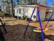 swing set and wood chips in the backyard at 6828 Delta Dr, Riverdale, GA 30274