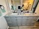 Modern bathroom with double sinks and marble countertops at 6828 Delta Dr, Riverdale, GA 30274