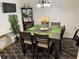 Spacious dining area with a square table and green placemats at 6828 Delta Dr, Riverdale, GA 30274