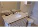Updated bathroom with granite countertop and white cabinetry at 20 Marietta Nw St # 13F, Atlanta, GA 30303