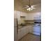 White kitchen cabinets and granite countertops at 20 Marietta Nw St # 13F, Atlanta, GA 30303