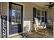 Front porch with rocking chairs and welcome sign at 5511 E Stoneway Ct, Villa Rica, GA 30180