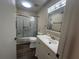 Bathroom with tub, shower, and white vanity at 475 Mount Vernon Ne Hwy, Atlanta, GA 30328