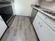 Kitchen features grey wood-look vinyl plank flooring at 475 Mount Vernon Ne Hwy, Atlanta, GA 30328