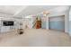 Finished basement area featuring built-in shelving, a stairway, and a cozy, carpeted floor at 282 Evelyn Nw St, Marietta, GA 30064