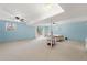 Spacious finished basement with light blue walls, carpet flooring, and sliding glass doors to the outside at 282 Evelyn Nw St, Marietta, GA 30064