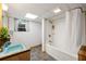 Basement bathroom featuring a vintage vanity and a tub-shower combo with white tile surround at 282 Evelyn Nw St, Marietta, GA 30064