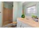 Cozy bathroom featuring tiled shower, vanity, and neutral decor at 282 Evelyn Nw St, Marietta, GA 30064