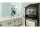 Charming bathroom featuring a white vanity and a wood cabinet for storage at 282 Evelyn Nw St, Marietta, GA 30064