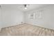 Bright bedroom with neutral carpet, a ceiling fan, and a window offering natural light at 282 Evelyn Nw St, Marietta, GA 30064