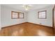 Bedroom featuring hardwood floors, white walls, and a ceiling fan at 282 Evelyn Nw St, Marietta, GA 30064