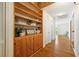 Inviting hallway showcasing wood floors, built-in shelving, and ample natural light at 282 Evelyn Nw St, Marietta, GA 30064
