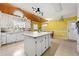 Bright kitchen featuring a center island, white cabinetry, and modern appliances at 282 Evelyn Nw St, Marietta, GA 30064