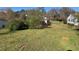 Large grassy backyard surrounded by mature trees, offering a serene and private outdoor space at 5121 Newark Ave, Clarkdale, GA 30111
