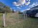 View of the backyard with chain link fence and sunny sky at 5121 Newark Ave, Clarkdale, GA 30111