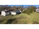 Property featuring spacious backyard with outbuilding and lush greenery in a peaceful neighborhood at 5121 Newark Ave, Clarkdale, GA 30111