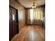 Bedroom featuring hardwood floors, wood paneling, a ceiling fan, and natural light at 5121 Newark Ave, Clarkdale, GA 30111