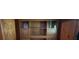 Elegant built-in cabinet with glass-fronted shelves and paneled doors at 5121 Newark Ave, Clarkdale, GA 30111