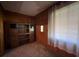 Entryway featuring wood paneled walls, carpet, and lots of natural light at 5121 Newark Ave, Clarkdale, GA 30111