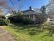 A charming single-story home with inviting curb appeal and a lush green yard at 5121 Newark Ave, Clarkdale, GA 30111