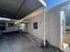 Exterior of home showcasing a covered parking area and a storage unit at 5121 Newark Ave, Clarkdale, GA 30111