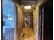 Hallway features a bright hallway with wood paneling, offering a welcoming and classic aesthetic at 5121 Newark Ave, Clarkdale, GA 30111