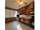 A functional kitchen with wood cabinets, tile floor, and complete set of appliances at 5121 Newark Ave, Clarkdale, GA 30111