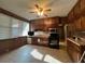 Bright and spacious kitchen featuring tile floors and lots of natural light, perfect for cooking and dining at 5121 Newark Ave, Clarkdale, GA 30111