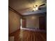 Living room featuring hardwood floors and wood-paneled walls at 5121 Newark Ave, Clarkdale, GA 30111
