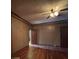 Spacious living room featuring hardwood floors, a ceiling fan, and ample natural light at 5121 Newark Ave, Clarkdale, GA 30111
