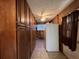 A spacious pantry area equipped with ample shelving, tile floors, and a full-sized refrigerator at 5121 Newark Ave, Clarkdale, GA 30111
