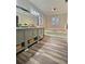 Spacious bathroom boasting double vanity, soaking tub and wood flooring at 4449 Inns Brook Dr, Snellville, GA 30039