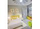 Bright bedroom with stylish decor, neutral walls, and a sunny window at 4449 Inns Brook Dr, Snellville, GA 30039