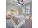 Cozy bedroom with fluffy gray rug, neutral walls, and lots of natural light at 4449 Inns Brook Dr, Snellville, GA 30039