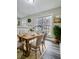 Dining room features hardwood floors, modern decor, and lots of natural light at 4449 Inns Brook Dr, Snellville, GA 30039