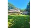 Two-story home featuring a covered front porch and large lawn at 4449 Inns Brook Dr, Snellville, GA 30039