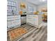 Bright kitchen featuring modern stainless steel appliances and light wood floors at 4449 Inns Brook Dr, Snellville, GA 30039