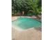 Large backyard pool with surrounding patio for relaxing and outdoor living at 4449 Inns Brook Dr, Snellville, GA 30039