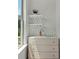 Small bar area with decorative shelving and glassware at 1084 Battery Park Rd, Decatur, GA 30033