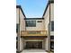Townhome exterior with a private deck and attached garage at 1084 Battery Park Rd, Decatur, GA 30033
