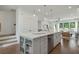 Kitchen island with seating and stainless steel dishwasher at 1084 Battery Park Rd, Decatur, GA 30033