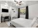 Bedroom with a queen bed, workspace, and large window at 1225 Church St # O, Decatur, GA 30030