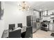 Modern kitchen features stainless steel appliances and a breakfast bar at 1225 Church St # O, Decatur, GA 30030