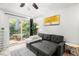 Bright living room with a pull-out sofa, access to the balcony, and elegant interior design at 1225 Church St # O, Decatur, GA 30030
