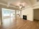 Spacious living room with hardwood floors, fireplace, and coffered ceiling at 399 Auburn Valley Way, Auburn, GA 30011